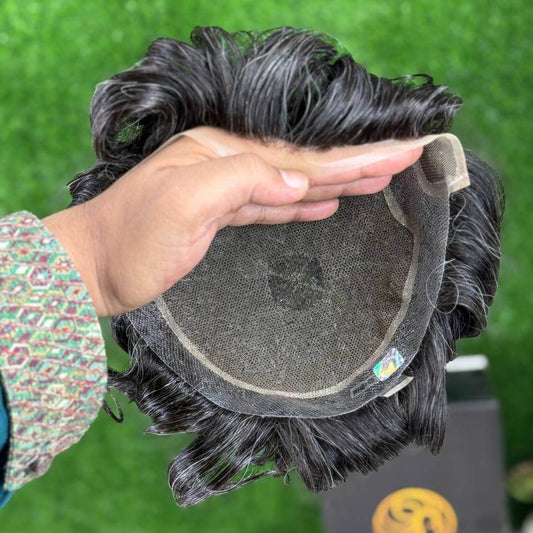 Hollywood Men's Wig design showcasing the underside of a men's toupee held in hand.