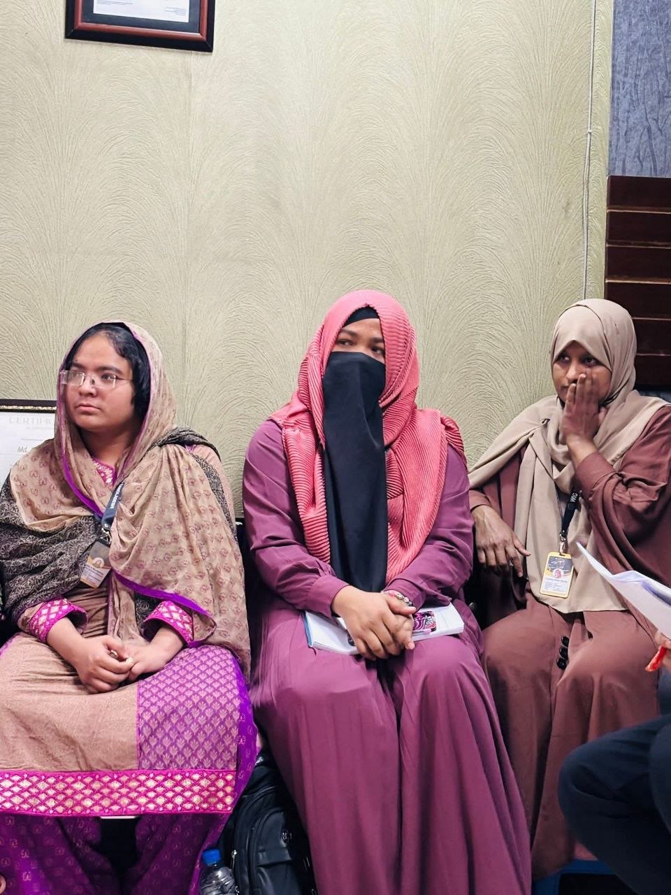 Women employees participating in the monthly team meeting