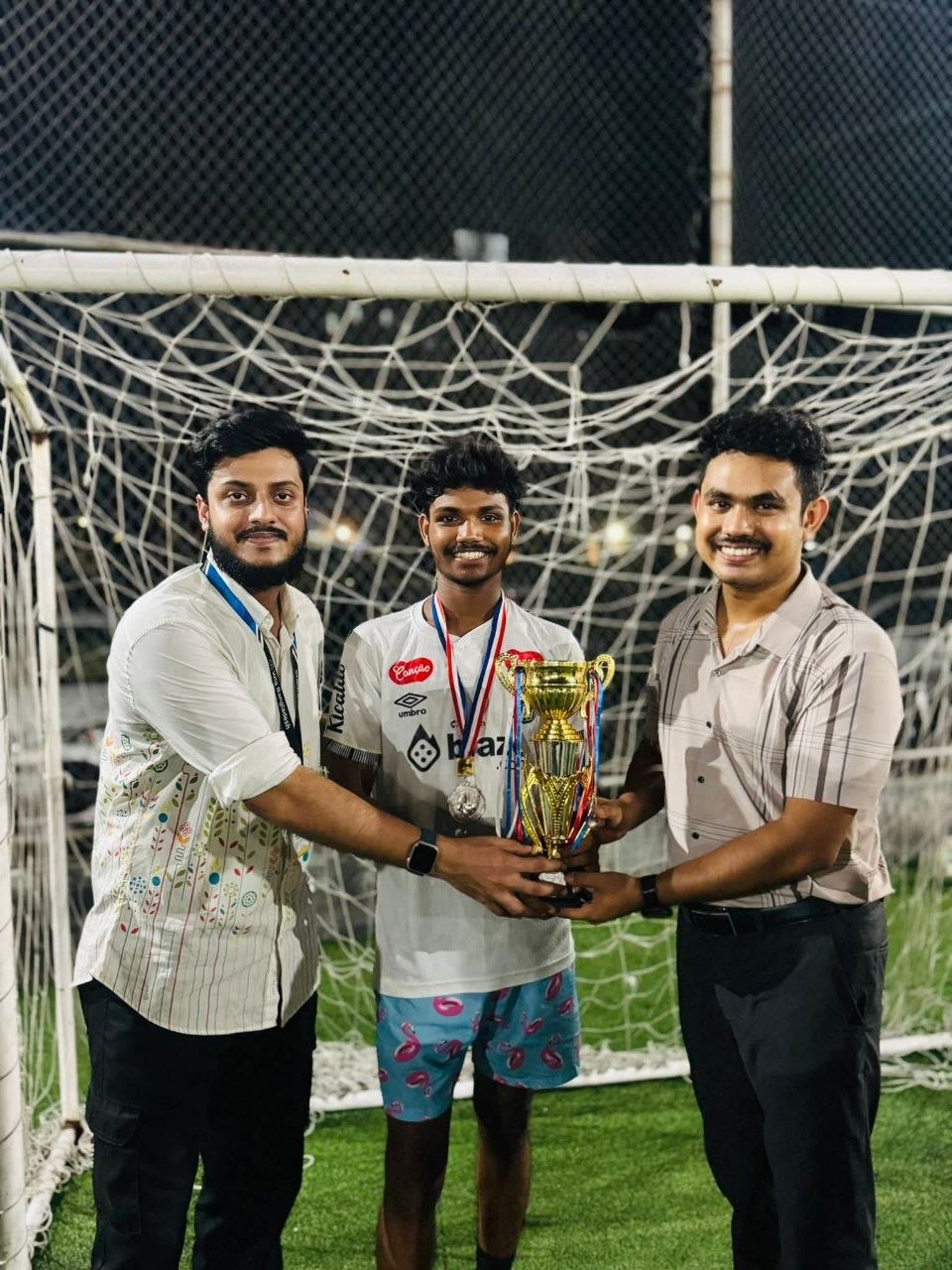 Football award presented to a young employee