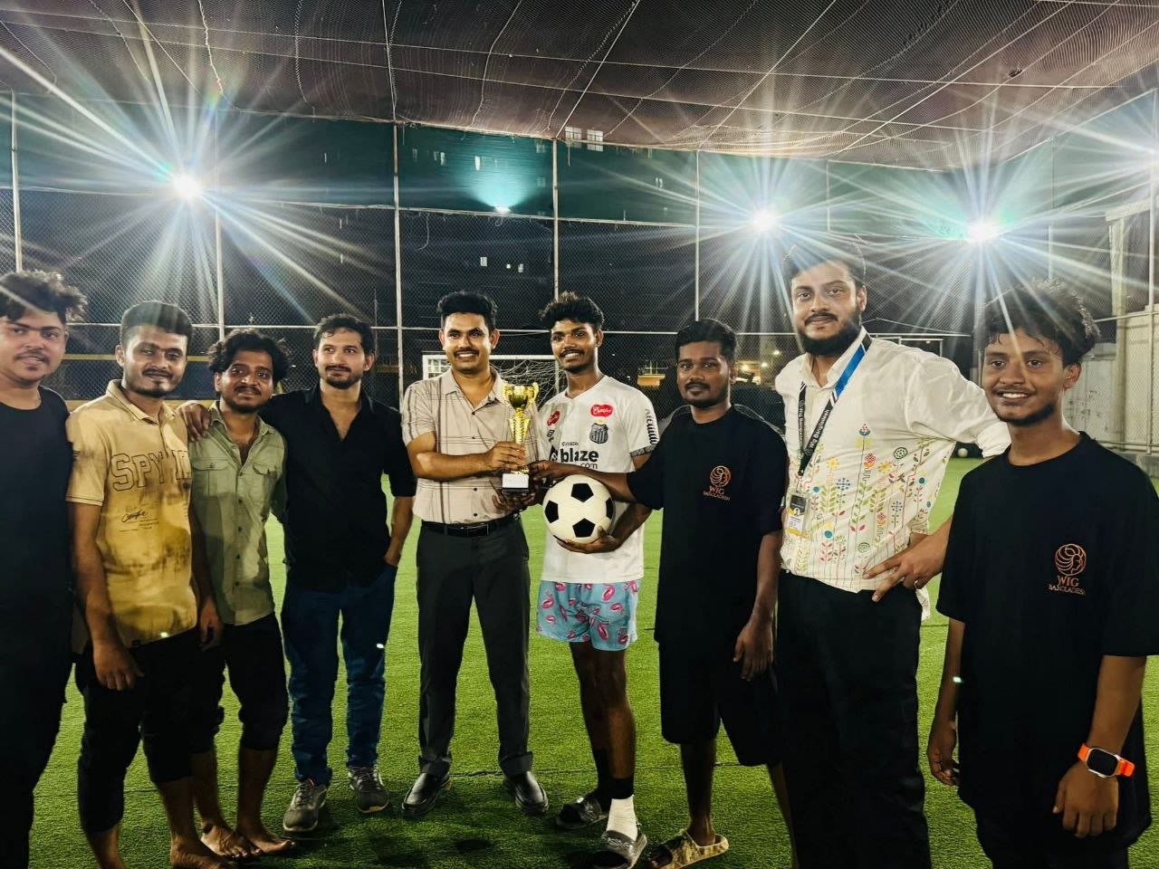 Wig Bangladesh colleagues gathered after a football match