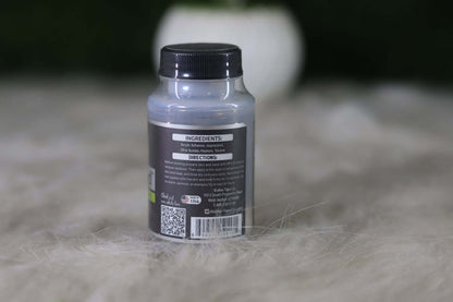Bottle with label on a textured surface