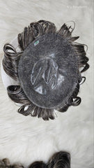 Black hair extension on a white background with visible branding.