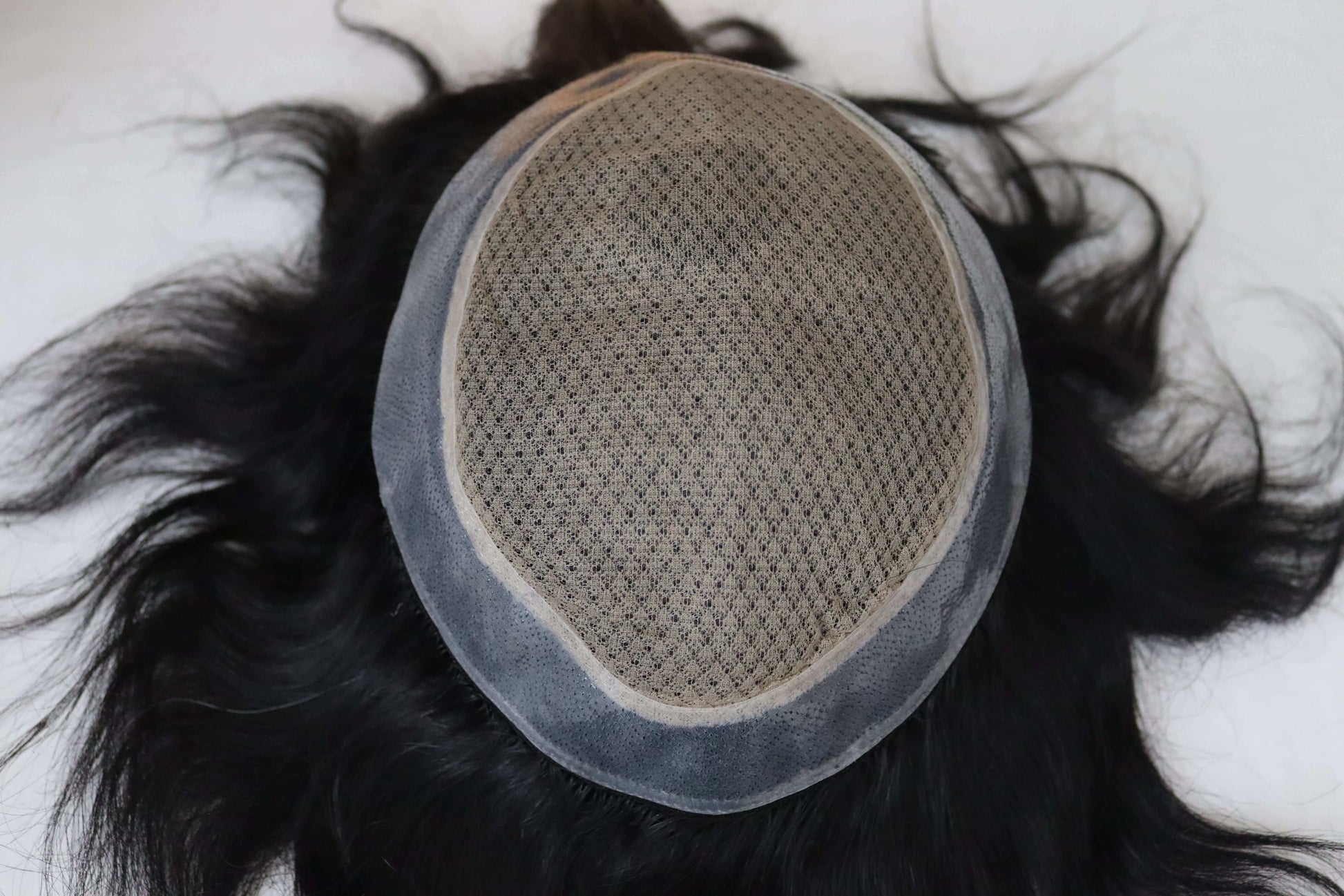 Miraz men's wig cap base showing natural hair and breathable design for comfort and durability.