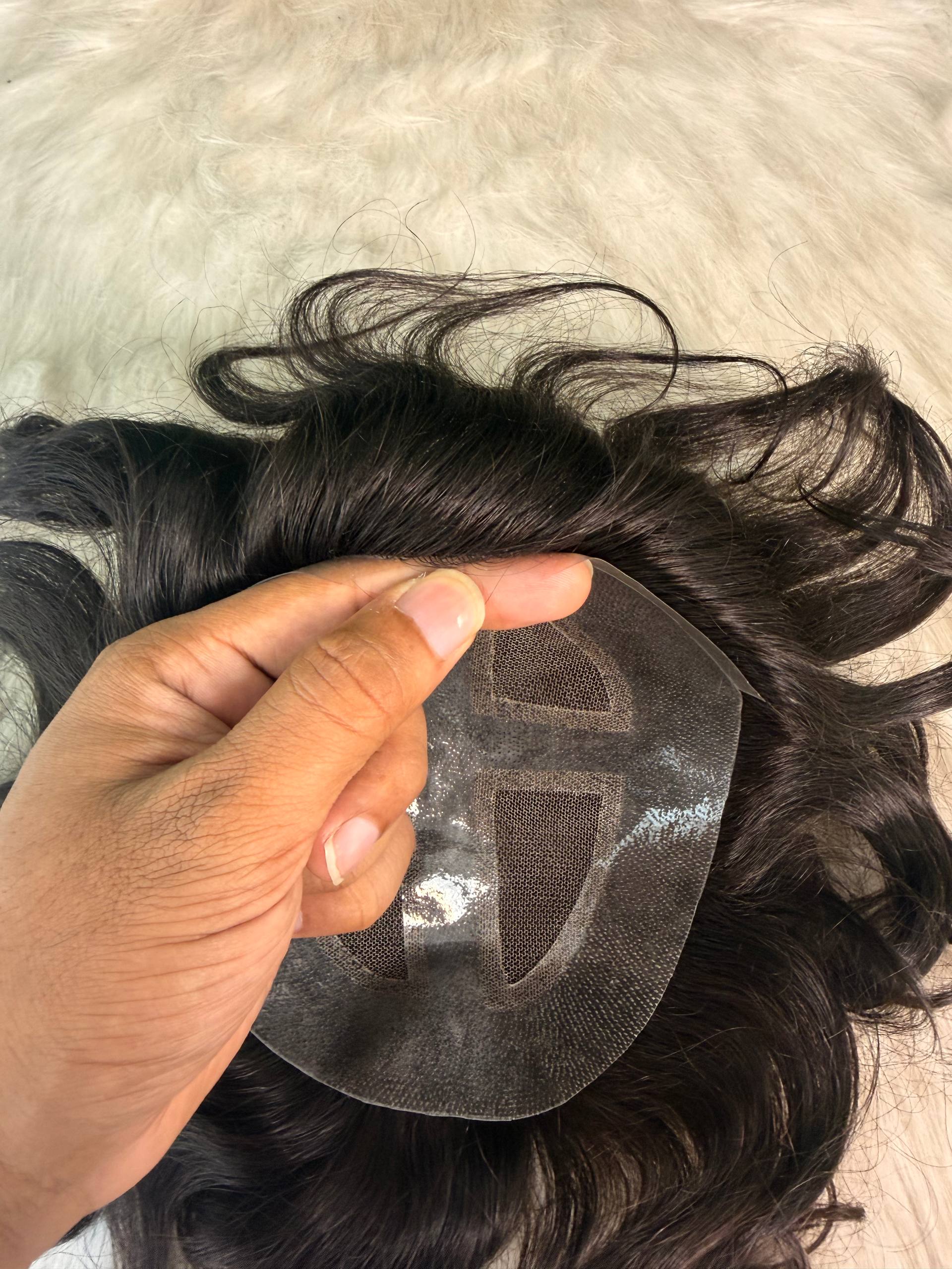 Top view of the X-Top Hair System showing the breathable mono top construction.