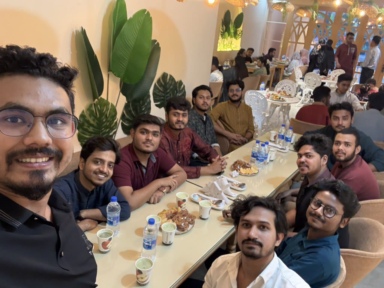 Wig Bangladesh team members sharing a group meal indoors