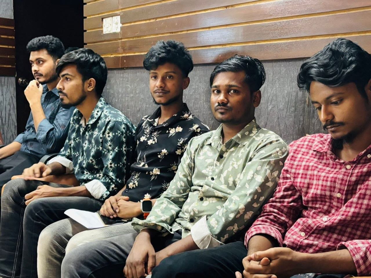Employees listening during the Wig Bangladesh monthly meeting