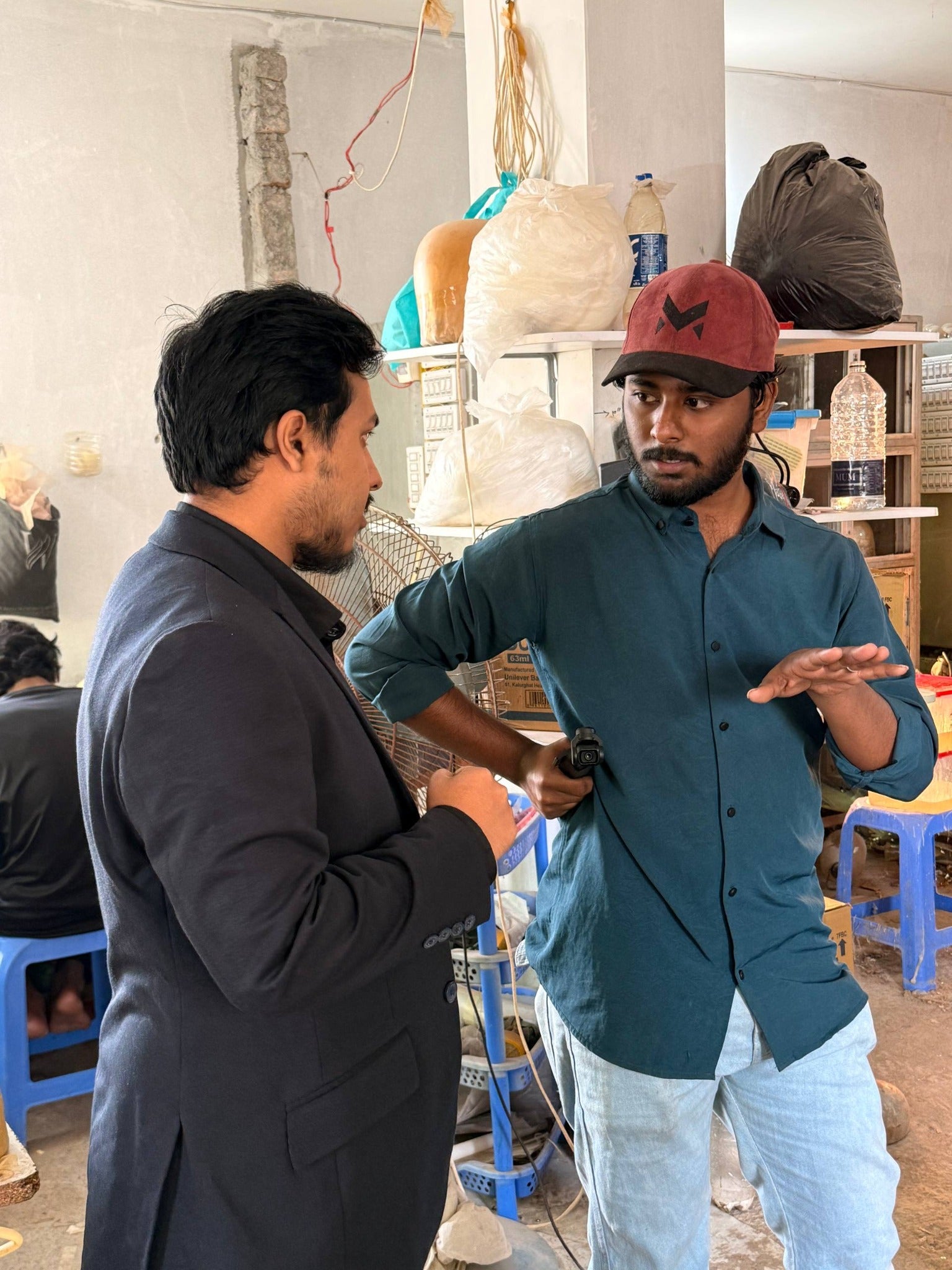 Production discussion between a factory representative and visitor
