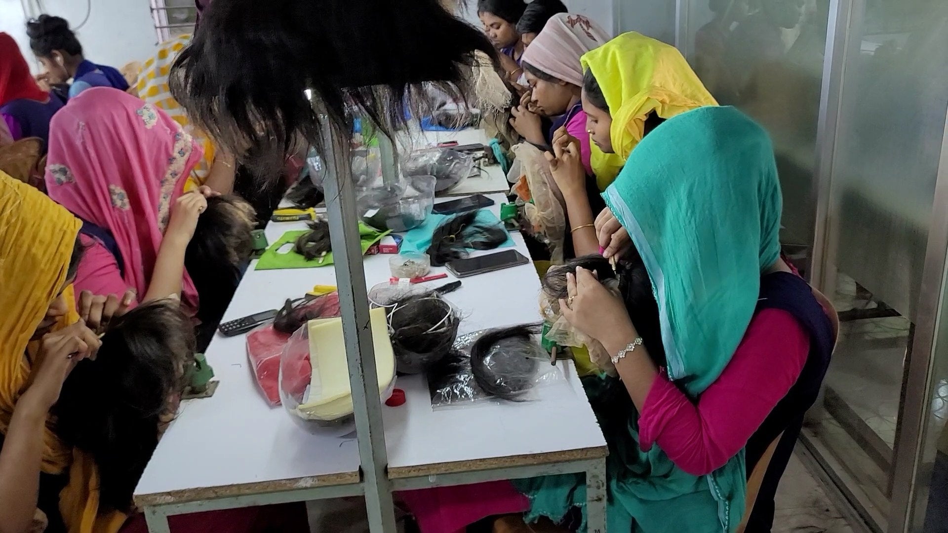 Wig Bangladesh artisans handcrafting hair systems in the factory